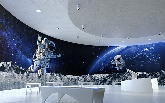 A space scene covers a curved wall
